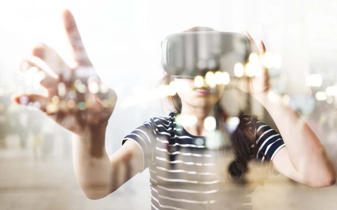 Double exposure of woman using the virtual reality headset